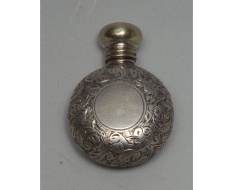 A late Victorian/early Edwardian lady's silver miniature moon-shaped scent bottle, profusely chased, domed turn-cover, 3cm di
