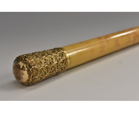 A 19th century Rococo Revival gilt-metal mounted faux blonde 'tortoiseshell' gentleman's walking stick, the pommel chased wit