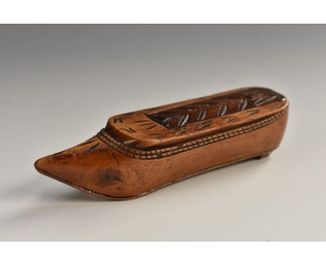 An early 19th century novelty snuff box, as a shoe, chip-carved sliding cover, 8.5cm long, c.1820