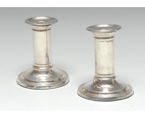 A pair of Victorian silver Doric column candlesticks, cannon barrel pillars, circular bases, 10cm high, Sheffield 1889
