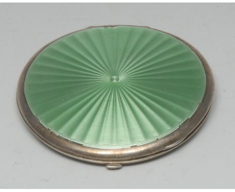 A George V silver and guilloche enamel circular compact, hinged cover and verso engine turned and decorated in tones of pale 