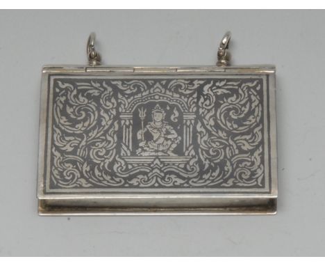 A 19th century Siamese silver and niello rectangular book shaped box, decorated with deities on a ground of scrolls, 5.5cm wi