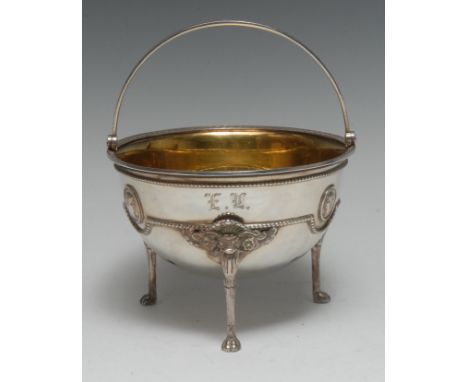 Tiffany &amp; Co - an American silver swing-handled hemi-spherical table dish, in the Adam Revival taste with profile portrai