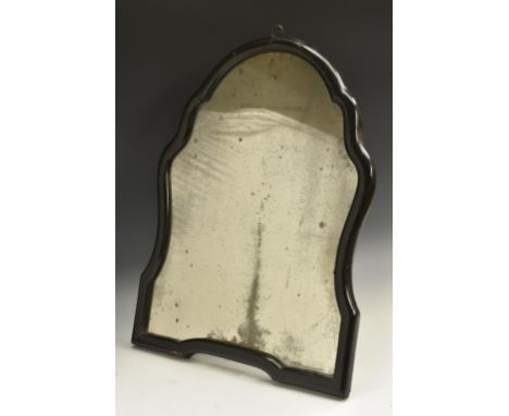 A Queen Anne ebonised shaped easel looking glass, mirror plate, urnular stretcher adjustable on a ratchet to verso, loop susp