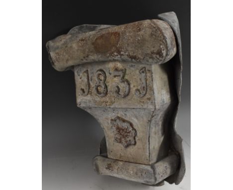 A William IV lead architectural rainwater hopper, applied with a boss and dated 1831, 40cm high, 35cm wide 