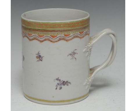 A Chinese Export porcelain cylinder mug, painted puce en camaïeu with scattered foliage, broad border painted in polychrome e