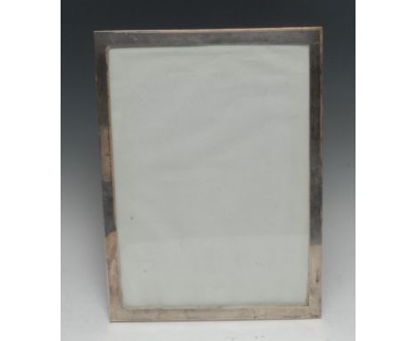 A large George V silver rectangular easel photograph frame, quite plain, 39cm high, 28.5cm wide, Colen Cheshire, Chester 1925