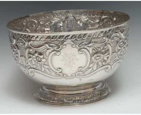 A large Victorian silver pedestal punch bowl, profusely chased with flowers, shells and leafy scrolls, domed foot, 29.5cm dia