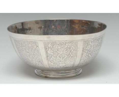 A Chinese silver bowl, engraved with panels of blossoming branches, birds and pagodas, 15.5cm diam, apparently unmarked, c.19