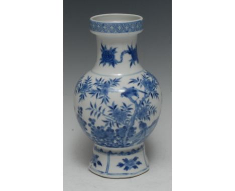 A Chinese baluster vase, painted in underglaze blue with the Three Friends of Winter and birds amongst branches, spreading oc