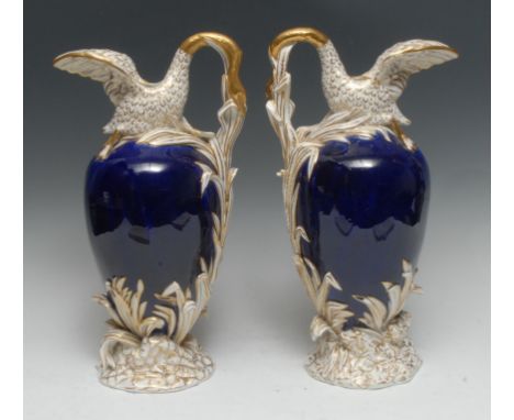 A pair of early 19th century English porcelain ewers, possibly H. & R. Daniel, and of Sèvres vase cygne à roseau en buire sha