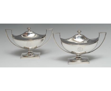 A pair of George III Neo-Classical silver urnular pedestal sauce tureens, domed covers, angular scroll handles, spreading ova
