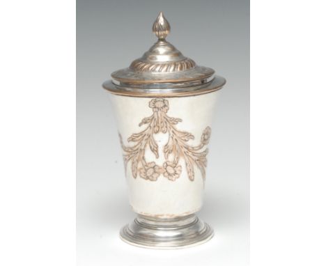 A George III Old Sheffield plate sugar vase and cover, flame finial, chased with a band of flowering leafy sprigs, skirted ba