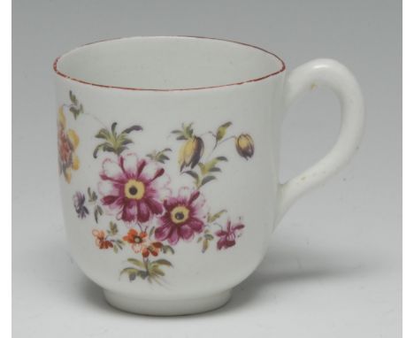 An early Derby coffee cup, painted in the manner of the Cotton-stem Painter with scattered country flowers, iron red rim, loo
