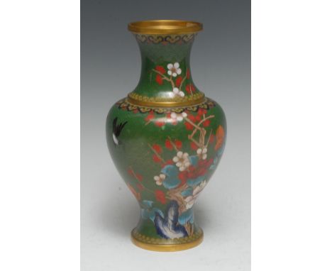 A Japanese cloisonné vase, enamelled with peonies and other foliage on a green ground, 23.5cm high, Meiji period