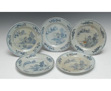 A set of five Chinese circular plates, decorated in underglaze blue with pagoda, huts, pine trees and rocks, the rims with st