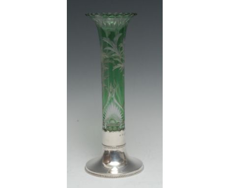 A late Victorian silver and green glass specimen vase, trumpet shaped reservoir engraved with sprays of flowers, lotus frieze