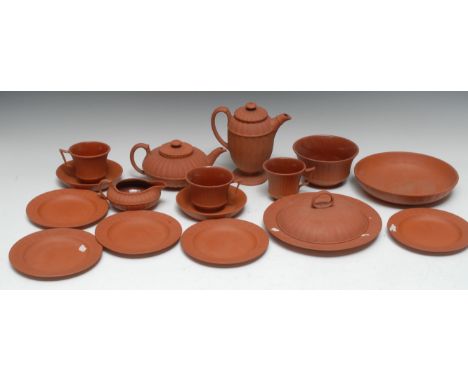 A mid 19th century Wedgwood Red Stoneware tea service, of lobed form, comprising teapot and cover, milk jug, sugar bowl, thre