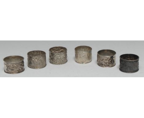 A collection of Chinese silver napkin rings, various designs and makers (6)