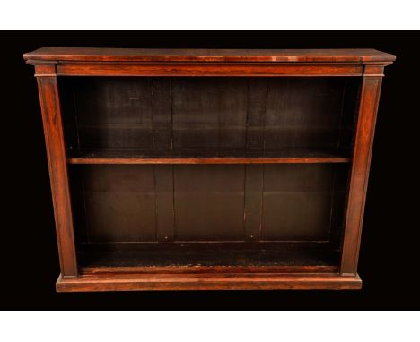 A George IV rosewood open bookcase, rectangular top above a deep frieze, adjustable shelves flanked by architectural angles, 