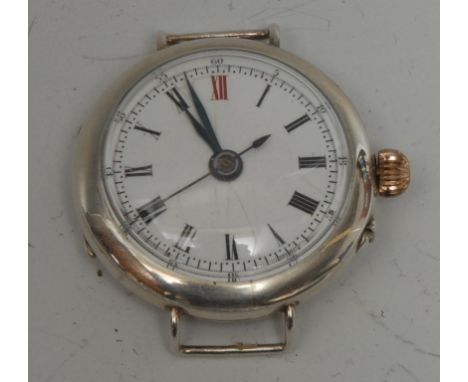 An Edwardian silver cased wristwatch head, white enamel dial, Roman numerals, red 12, minute track, blued hands, centre secon