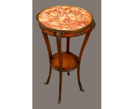 A Louis XVI Revival bronze mounted mahogany Gueridon, circular marble top and a deep frieze caprine masks, serpentine legs, o