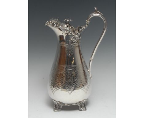 A large Victorian silver baluster wine ewer, lofty scroll handle, hinged cover applied with a border of fruiting vine and eng