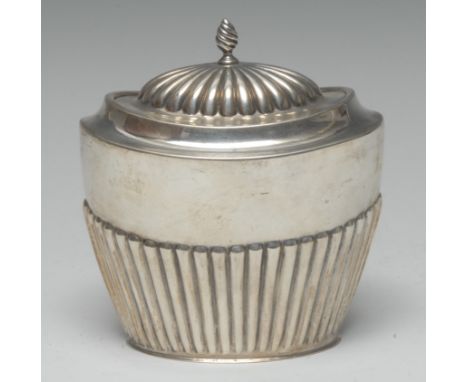 A Queen Anne Revival silver half-fluted oval tea caddy, hinged domed cover with spiral-knop finial, 10cm wide, marks rubbed, 