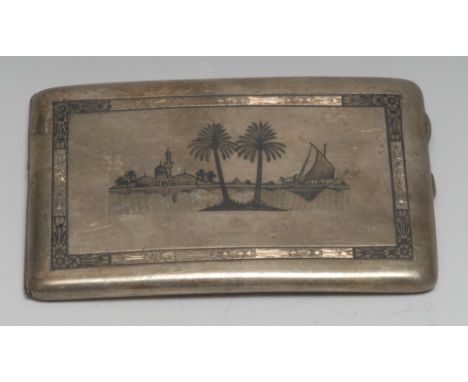 A Middle Eastern silver and niello curved rounded rectangular cigarette case, hinged cover decorated with a mosque, 13.5cm wi