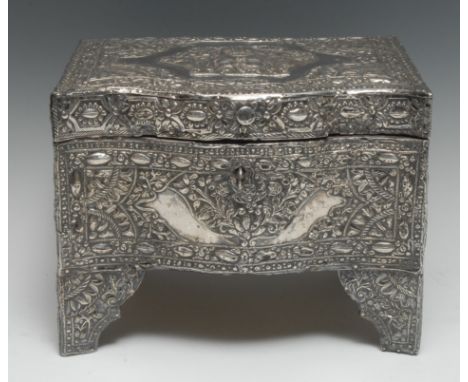 A large Middle Eastern silver clad serpentine dowry casket, profusely chased in the Islamic taste with flowers and foliage, h