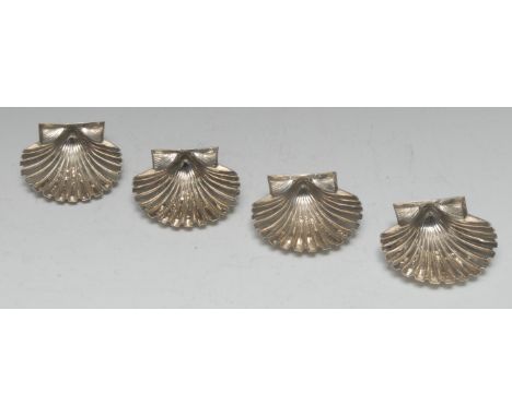 A set of four Continental silver shell shaped dishes, 9cm wide, maker ME, 7.75oz 