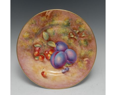 A Royal Worcester circular plate, painted by John Freeman, signed, with plums and cherries, on a mossy ground, 26.5cm diamete