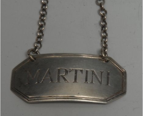 A George III Irish silver canted rectangular wine label, Martini, reeded border, 5cm wide, maker IE, retailed by Jacob West, 