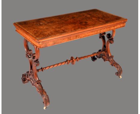 An unusually large Victorian burr walnut rounded rectangular card table, quarter veneered folding top enclosing an inset baiz