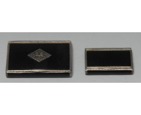 An Art Deco silver and noir enamel cigarette case or snuff box, hinged cover applied with a marcasite set lozenge, gilt inter