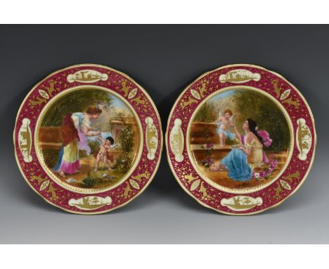 A pair of Austrian cabinet plates, printed and painted with classical ladies and cherubs, signed Katzka, beaded gilt cartouch