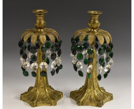 A pair of post-Regency gilt-patinated bronze lustres, as stylized exotic palms, the hexafoil bases cast with trailing bellhus