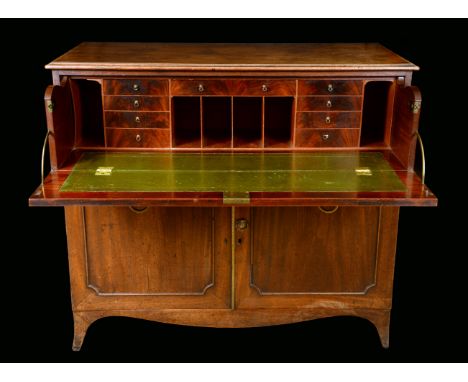 A Post-Regency mahogany secretaire, moulded rectangular top above a fitted drawer and a pair of doors, outswept bracket feet,