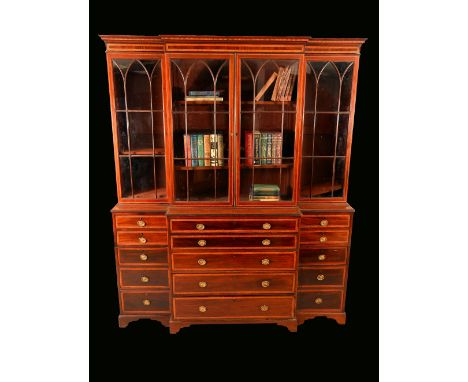 A 19th century mahogany break-centre secretaire library bookcase, stepped cornice above two pairs of Gothic glazed doors, enc