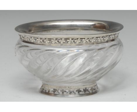 A French silver mounted clear glass wrythen oval sweetmeat bowl, flared rim and spreading foot pierced and engraved with band