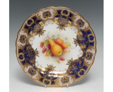 A Royal Worcester shaped circular plate, painted by Albert Shuck, signed, with ripe pears and raspberries, within fancy gilt 