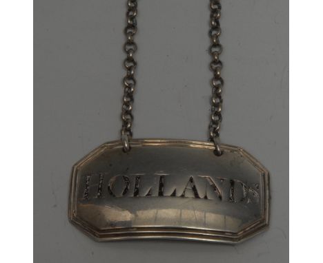 A George III provincial silver canted rectangular wine label, Hollands, reeded border, 5cm wide, York c.1800