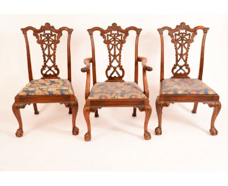 A set of six Chippendale Revival mahogany dining chairs, comprising four side chairs and a pair of carvers, shaped backs with
