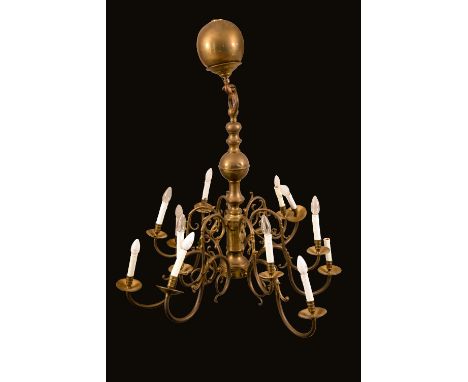 A William and Mary style brass twelve light electrolier, scroll branches, 104cm high
