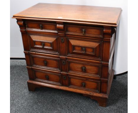 A Charles II fruitwood block-front chest, moulded rectangular top above four long drawers applied with geometric mouldings, s