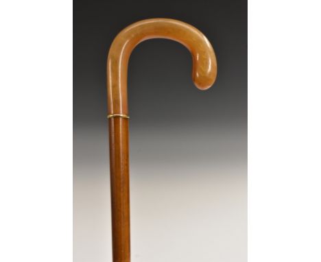 A late 19th century gentleman's gilt-metal mounted horn and malacca walking stick, crook-shaped handle, slim collar, slightly