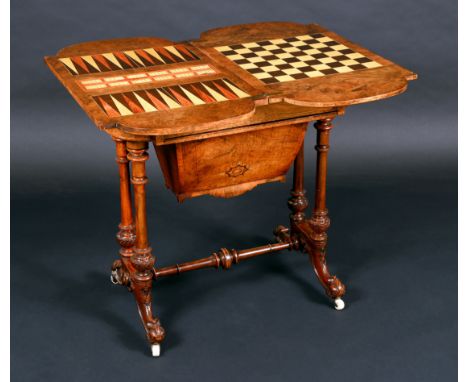 A Victorian burr walnut and marquetry combination games and work table, quarter-veneered top enclosing a plateau inlaid for c