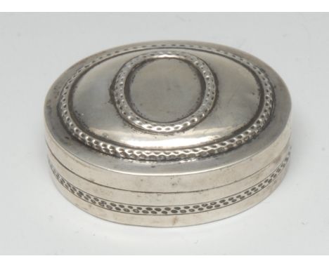 A Continental silver oval snuff box, push-fitting cover embossed with oval reserves, 5cm wide, 19th century