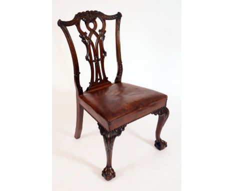 A Chippendale Revival mahogany side chair, cupids bow cresting rail and shaped splat carved with scrolling acanthus, stuffed 