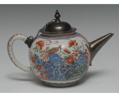 An early 18th century Chinese porcelain bullet-shaped teapot, painted in polychrome enamels with a golden pheasant resting on